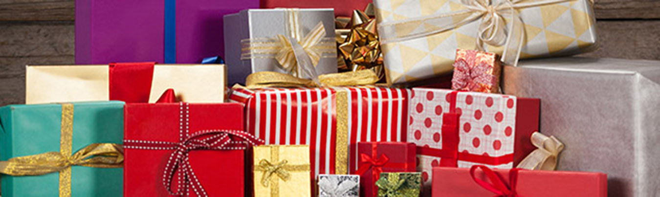 Various wrapped gift box on wooden table during christmas time